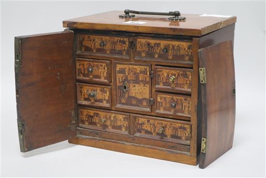 A miniature cabinet made from early German inlay panels